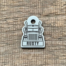 Load image into Gallery viewer, Personalised semi truck dog tag engraved with the name Rusty on brushed nickel silver, featuring a front-facing road train design.