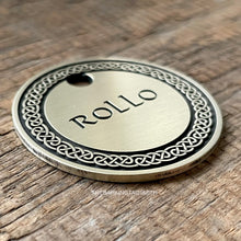 Load image into Gallery viewer, Dog ID tag with detailed Celtic knot border deep engraved on round metal tag, personalised engraved pet tag with the name Rollo