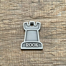 Load image into Gallery viewer, Dog ID tag shaped like a chess rook piece with the name Rook engraved, personalised deep engraved metal pet tag with a clean minimal design.