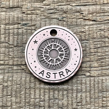 Load image into Gallery viewer, Dog ID tag with compass and star design and the name Astra engraved, personalised deep engraved metal pet tag with travel and adventure theme.