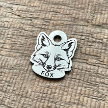 Load image into Gallery viewer, Dog ID tag shaped like a fox head with detailed deep engraved fox face design, personalised engraved metal pet tag for wildlife and nature lovers.