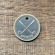 Load image into Gallery viewer, Dog ID tag with crossed golf clubs deep engraved on round metal tag, personalised engraved pet tag for golf lovers with the name Spencer.