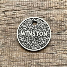 Load image into Gallery viewer, Dog ID tag with ornate scroll pattern and the name Winston engraved, personalised deep engraved metal pet tag with elegant vintage design.