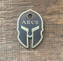 Load image into Gallery viewer, Dog ID tag shaped like a Spartan warrior helmet with deep engraved metal design, personalised engraved pet tag with the name Ares.