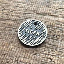 Load image into Gallery viewer, Personalised tiger stripe dog ID tag with engraved tiger fur pattern and raised Tiger name in brushed silver metal on rustic wood background