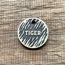 Load image into Gallery viewer, Personalised tiger stripe dog ID tag with engraved tiger fur pattern and raised Tiger name in brushed silver metal on rustic wood background