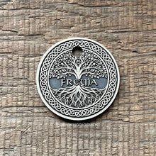 Load image into Gallery viewer, Dog ID tag with Viking Tree of Life design deep engraved on round metal tag, personalised engraved pet tag featuring the name Freyja.