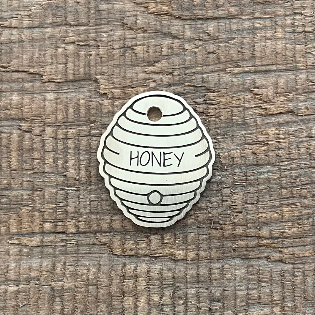 pet tag shaped as a beehive