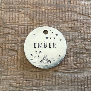 pet ID tag with fire pit design