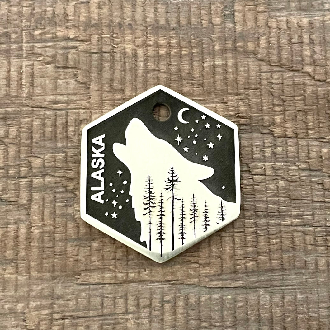 pet tag with wolf howling design